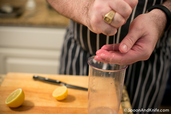 Mike juicing the lemons and catching the seeds