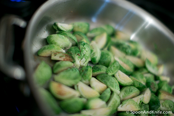 Caramelized Brussels Sprouts cooking in a pan